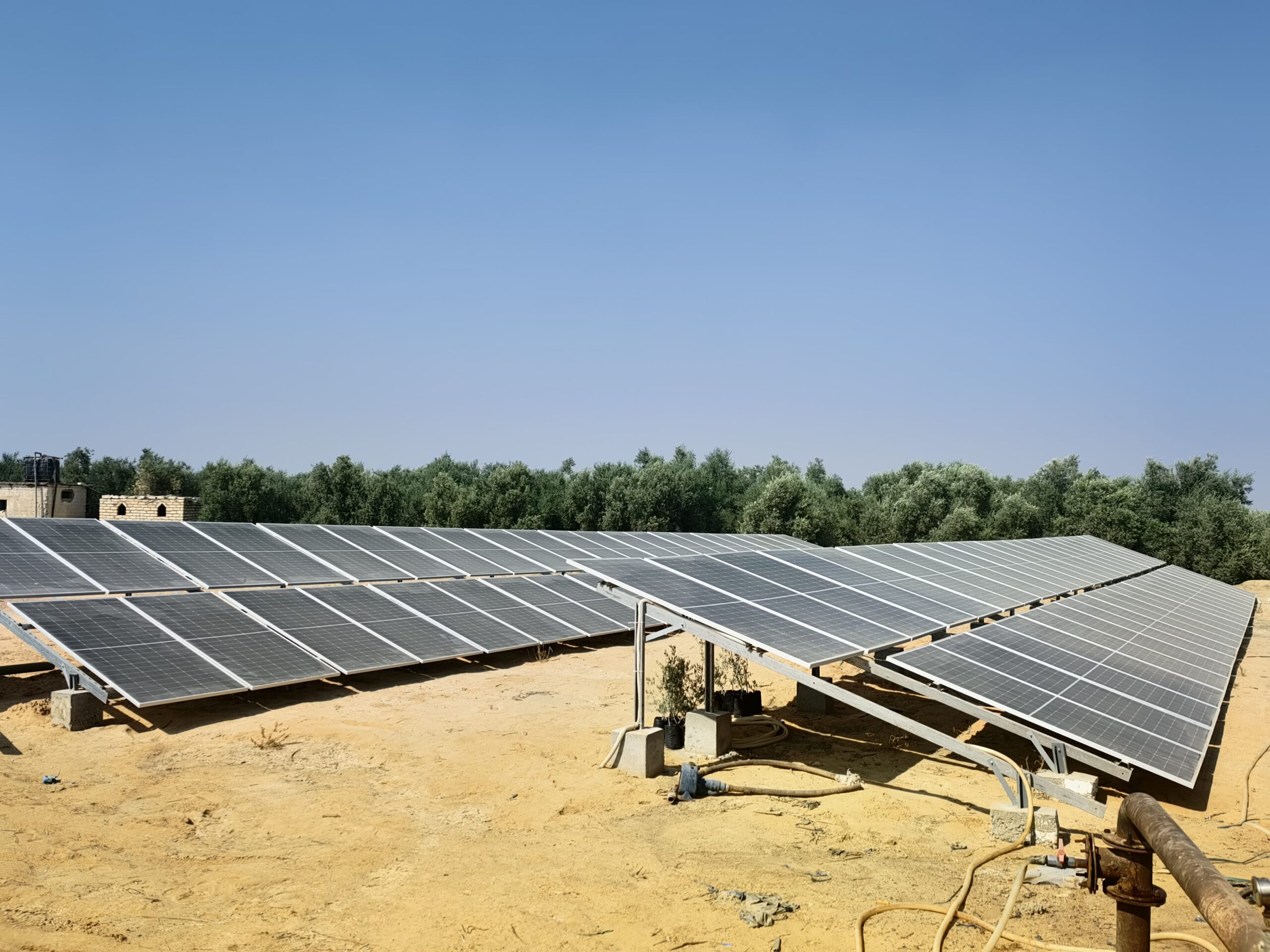 Solar Seeker technician configuring off grid water well pump system