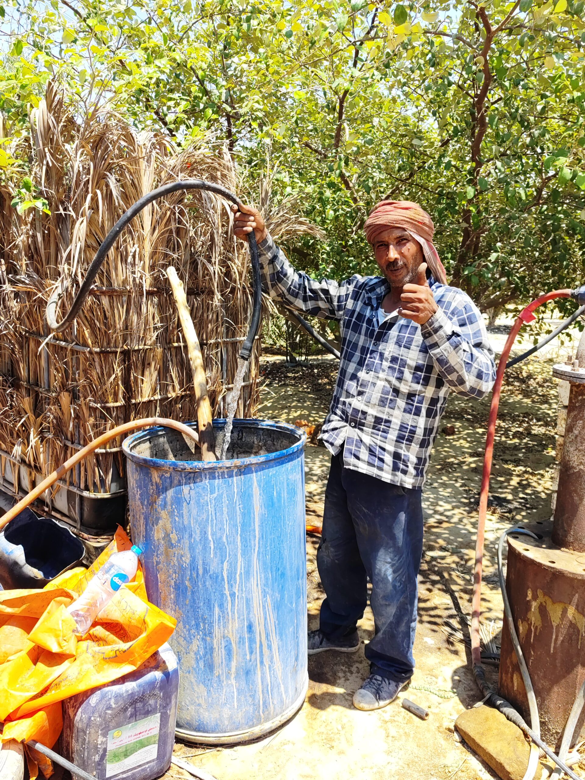 Village resident successfully using solar water pump system