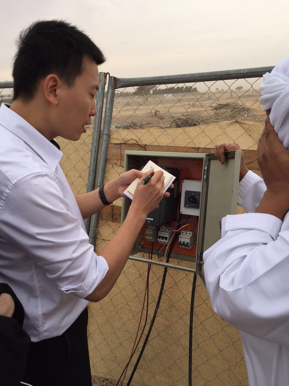 Andy training local engineers on solar water pump installation