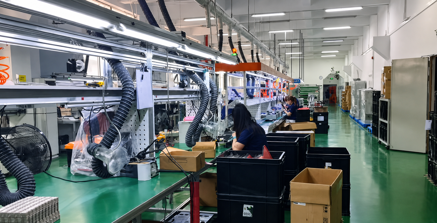 SolarSeeker solar pump inverter production line with workers assembling orders